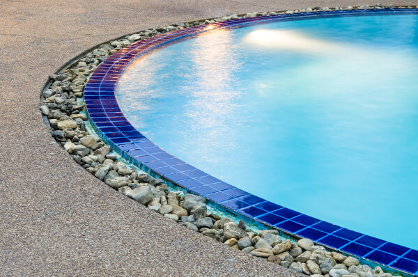 Inground-pool-Finishes-with-blue-tiles-and-pebbles
